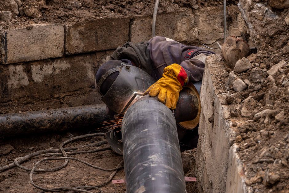 Close-up of a drainage pipe repair site in a Somerset garden